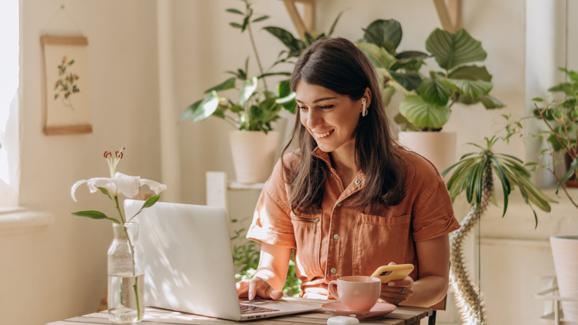 woman on computer office plants